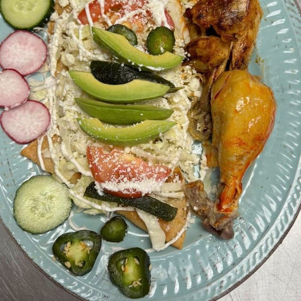 Mi Rinconcito's Mexican dish with chicken, tortillas, avocado, radishes, cucumbers, and jalapeños.